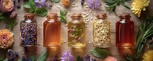 a group of bottles with liquid and flowers