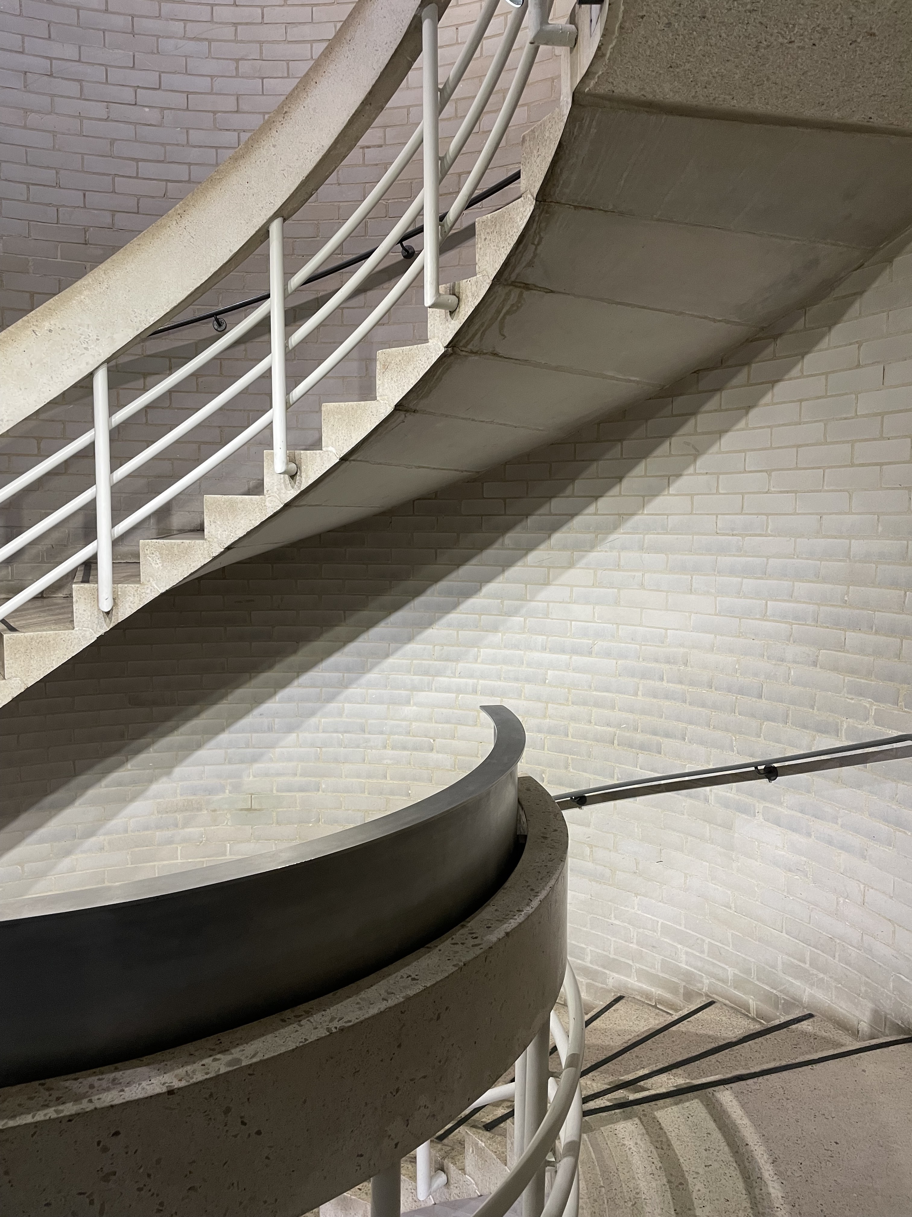 a spiral staircase with a railing