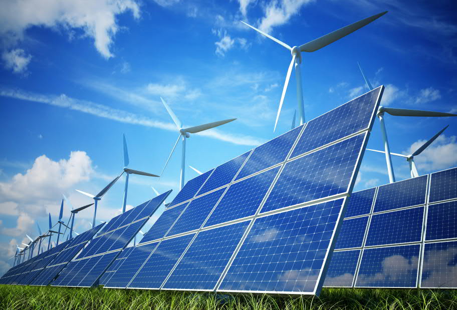 solar panels and wind turbines in a field