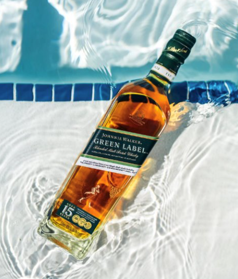 a bottle of alcohol in a pool