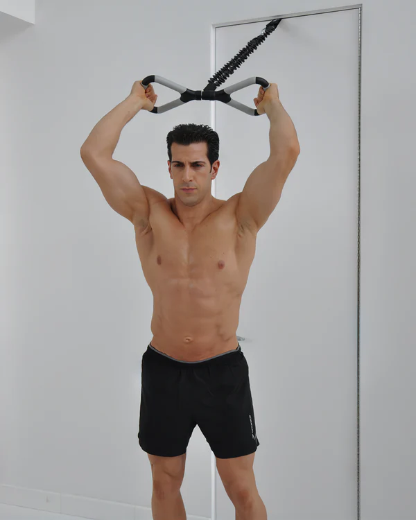 a man holding up a exercise equipment