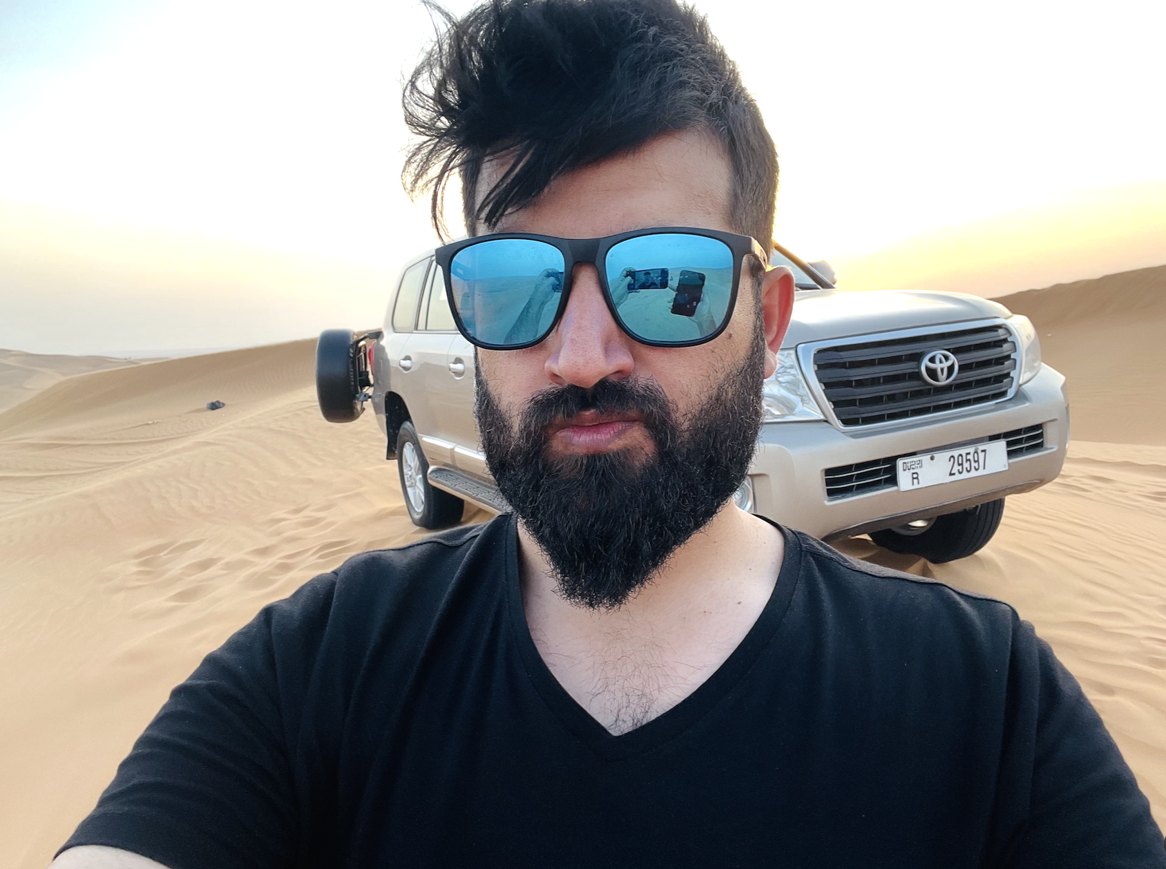 a man taking a selfie in the desert