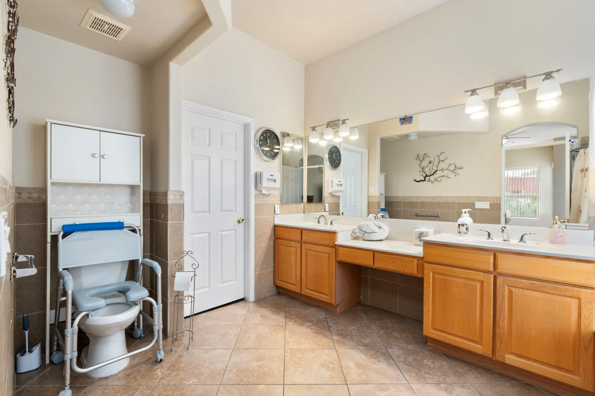 a bathroom with a large mirror and sinks