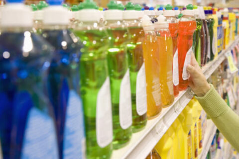 a close-up of a shelf with bottles of liquid