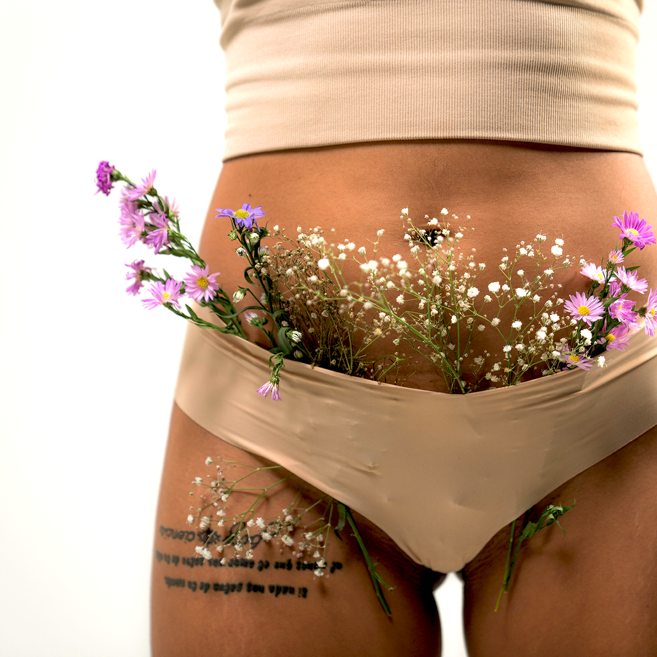 a woman's butt with flowers in it