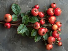 a bunch of red berries on a gray surface