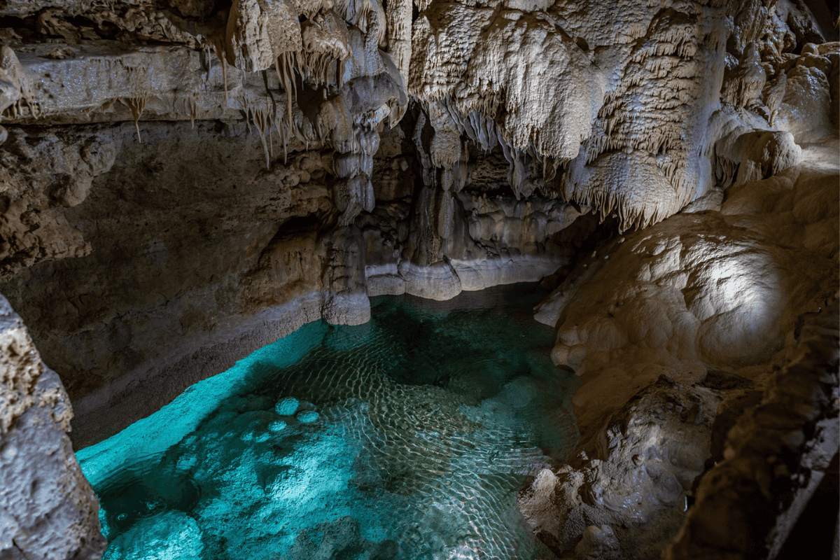 a cave with a pool of water