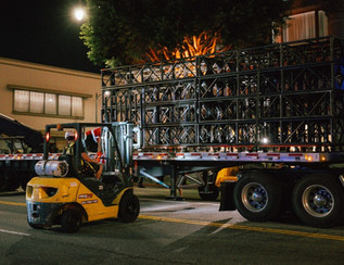a forklift moving a large metal structure