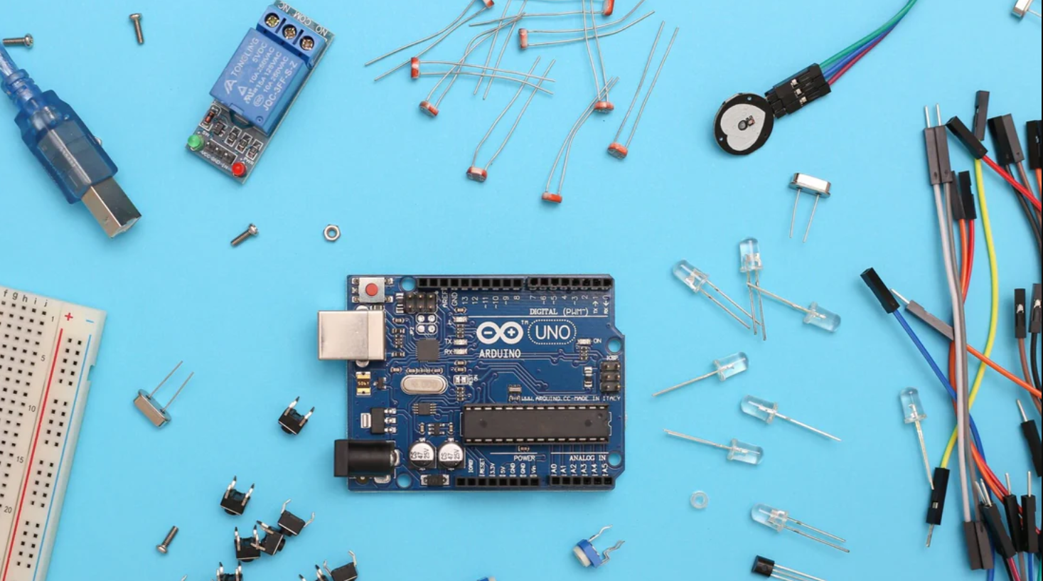 a blue circuit board with different components