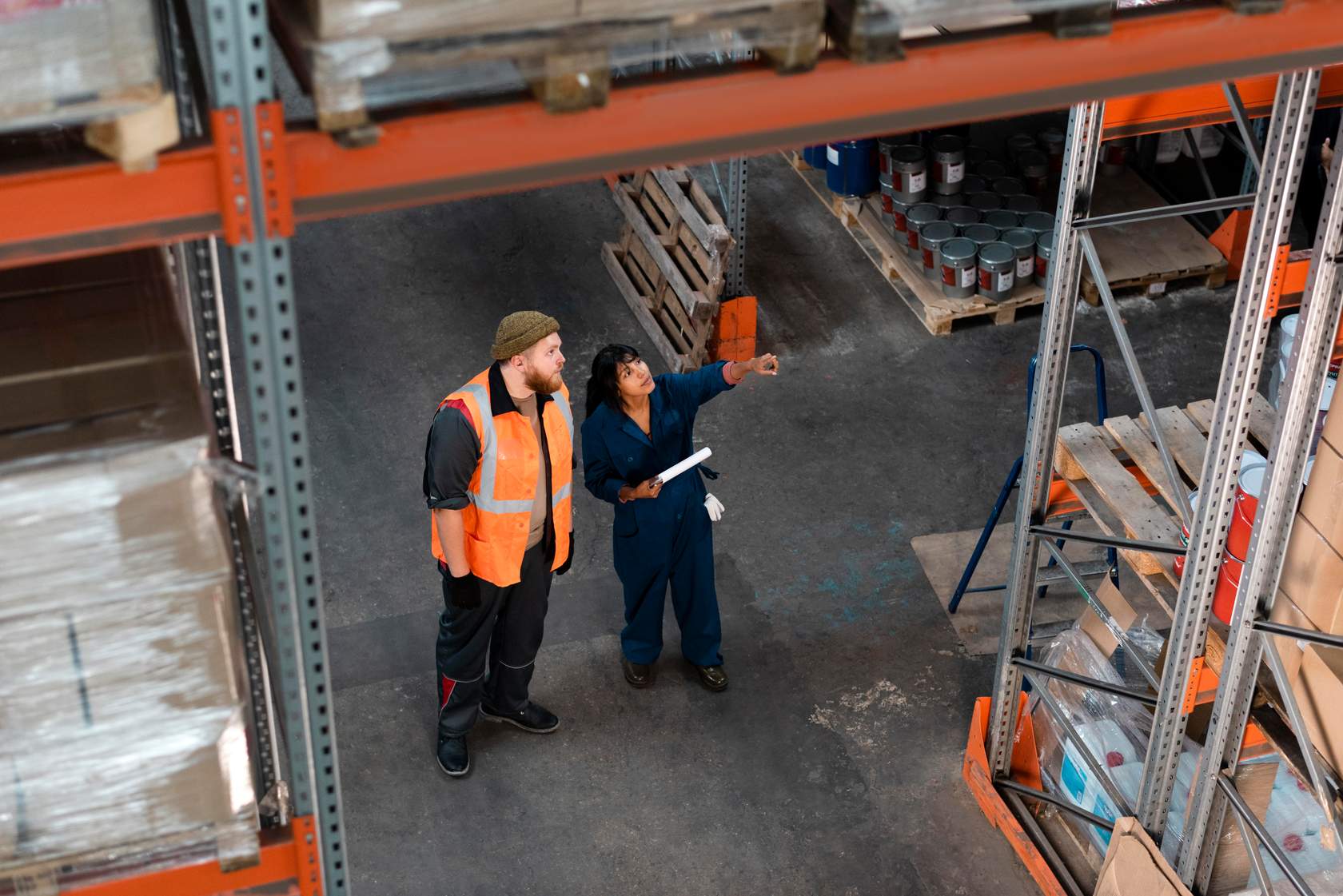 a man and woman in a warehouse