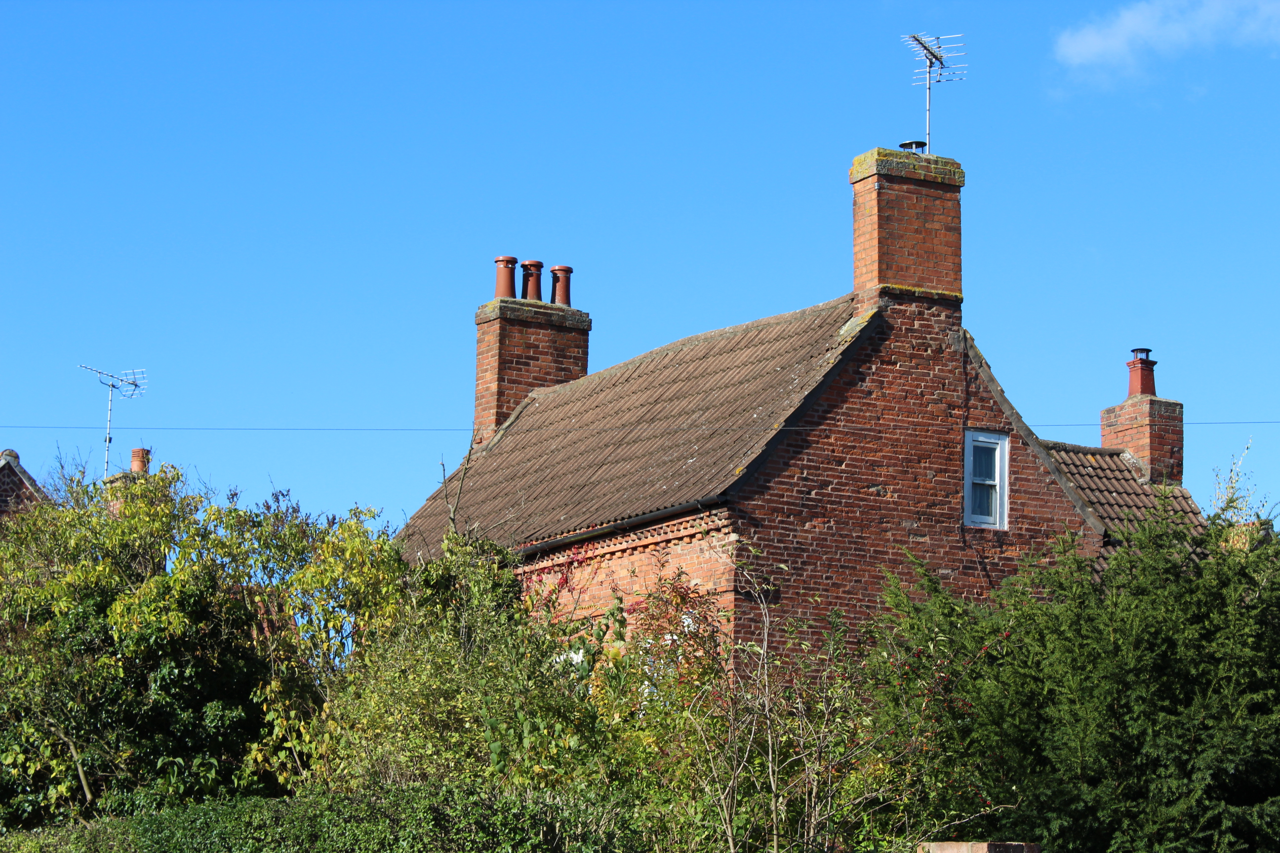 a brick house with a chimney