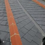 a roof with a red stripe