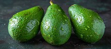 a group of avocados on a table