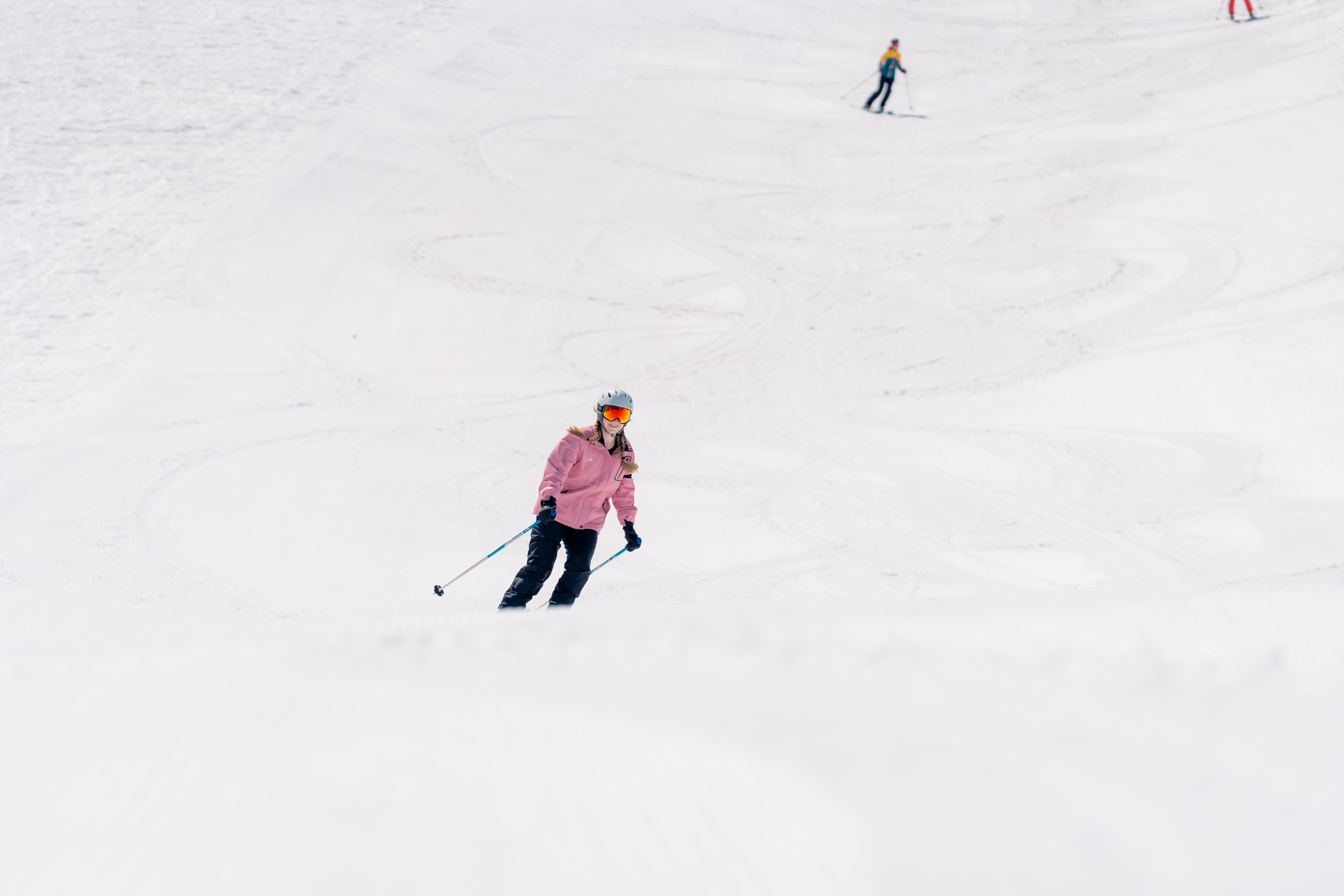 a person skiing down a snowy hill