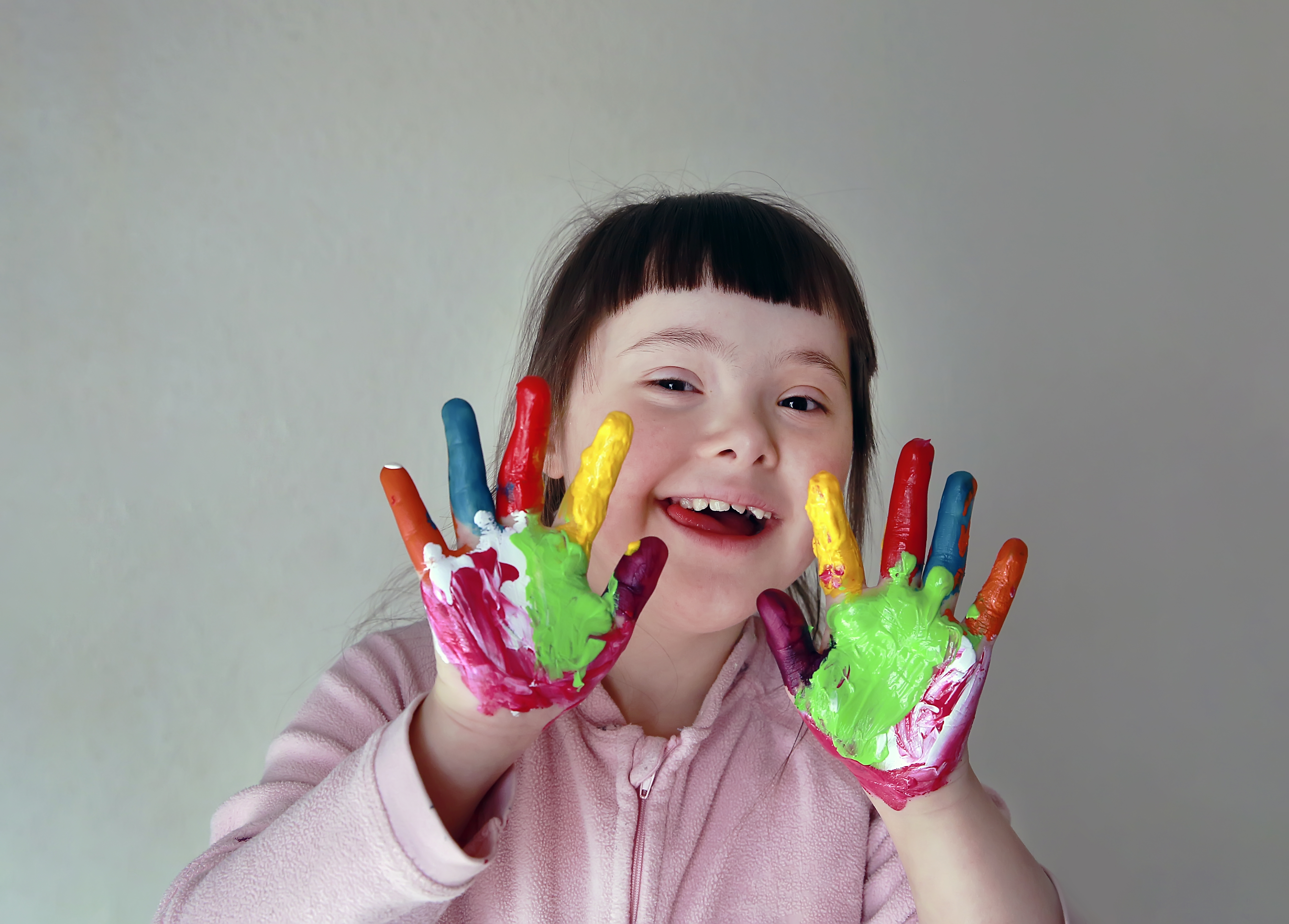 a girl with painted hands