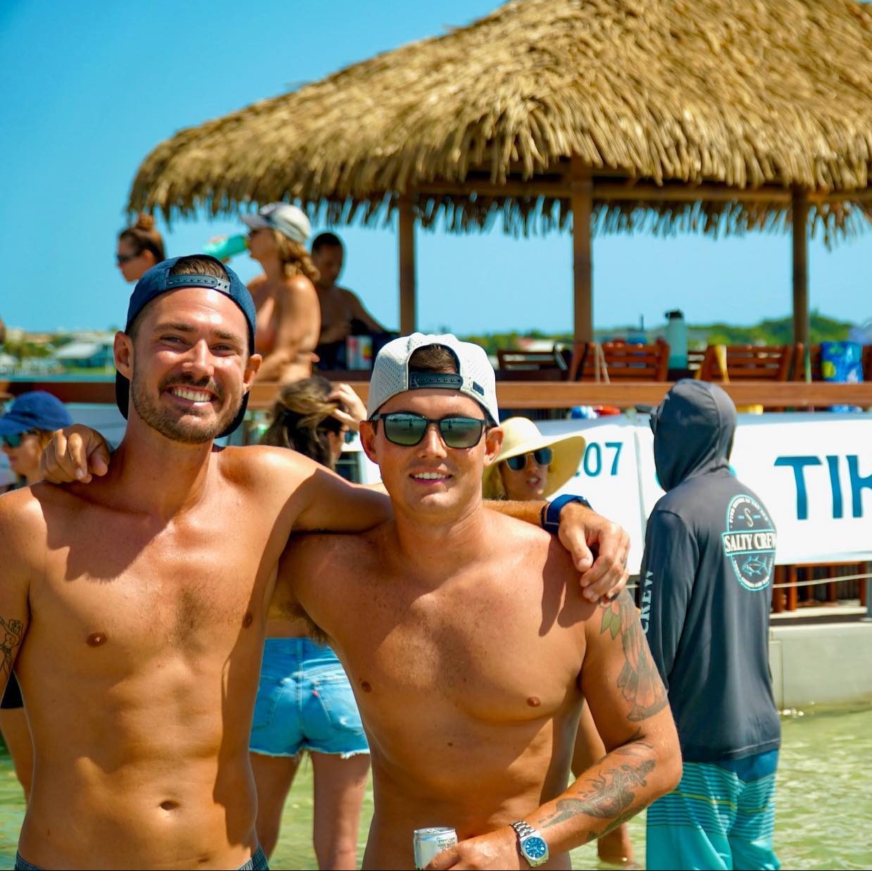 two men standing in water