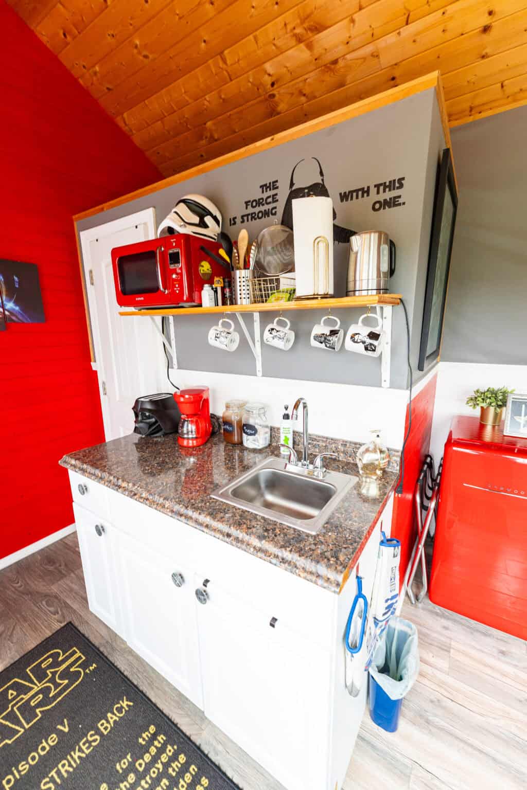 a kitchen with a sink and microwave