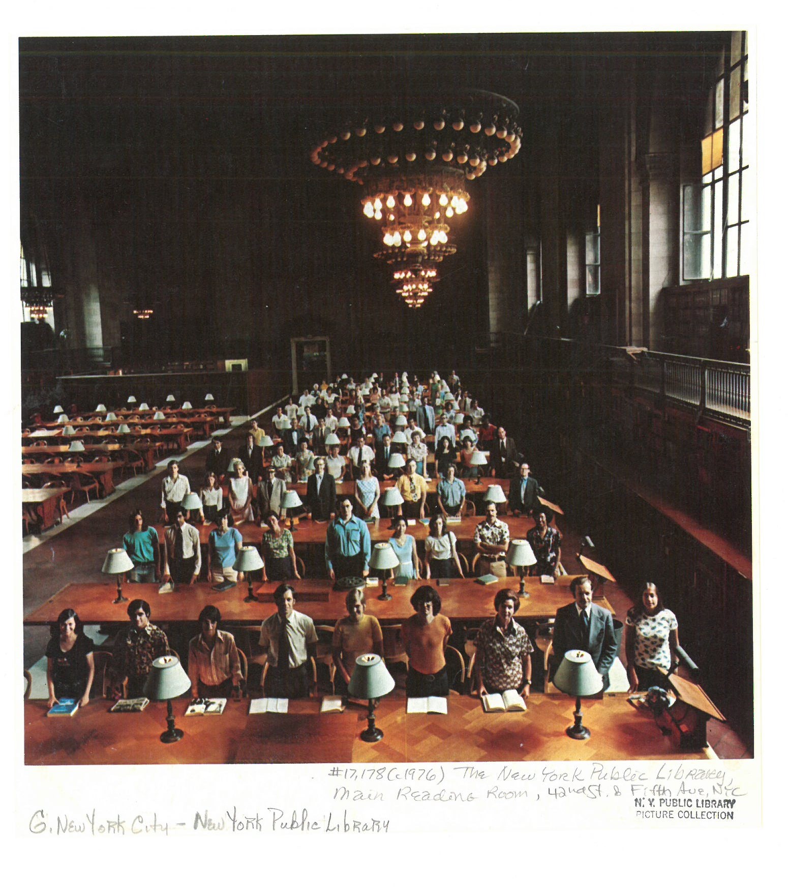a group of people sitting at tables in a large room