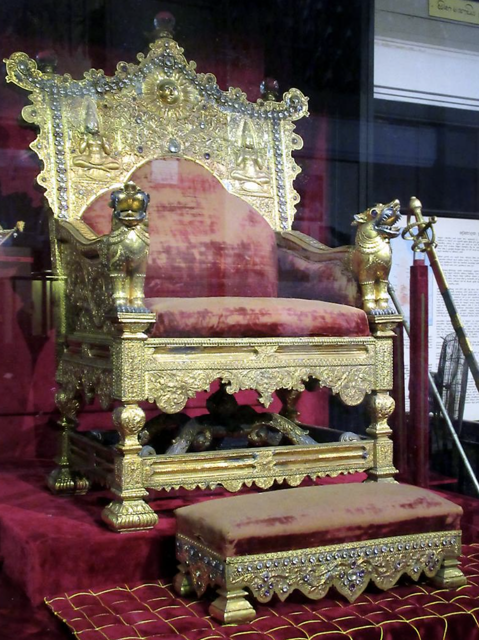 a gold and red throne