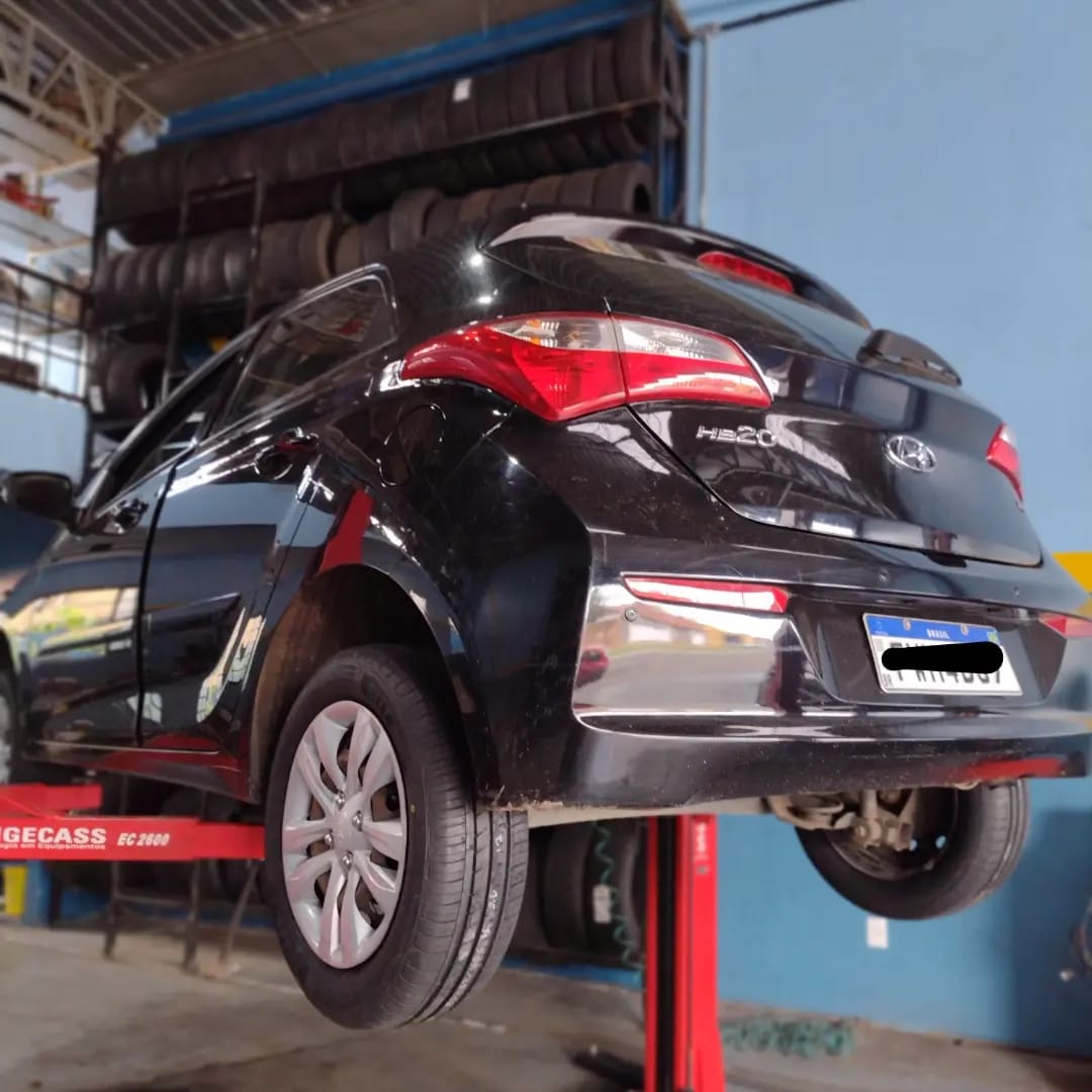 a car on a lift in a garage