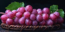 a basket of grapes with leaves