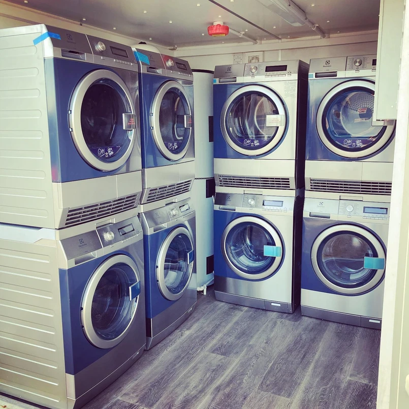 a group of washing machines in a room