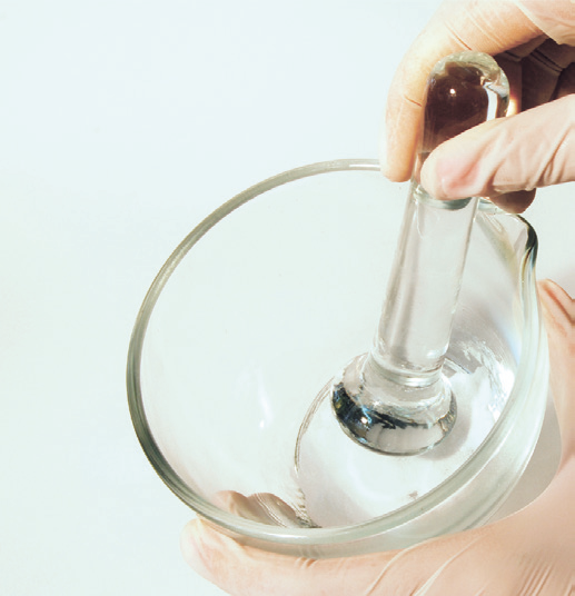 a person holding a glass bowl