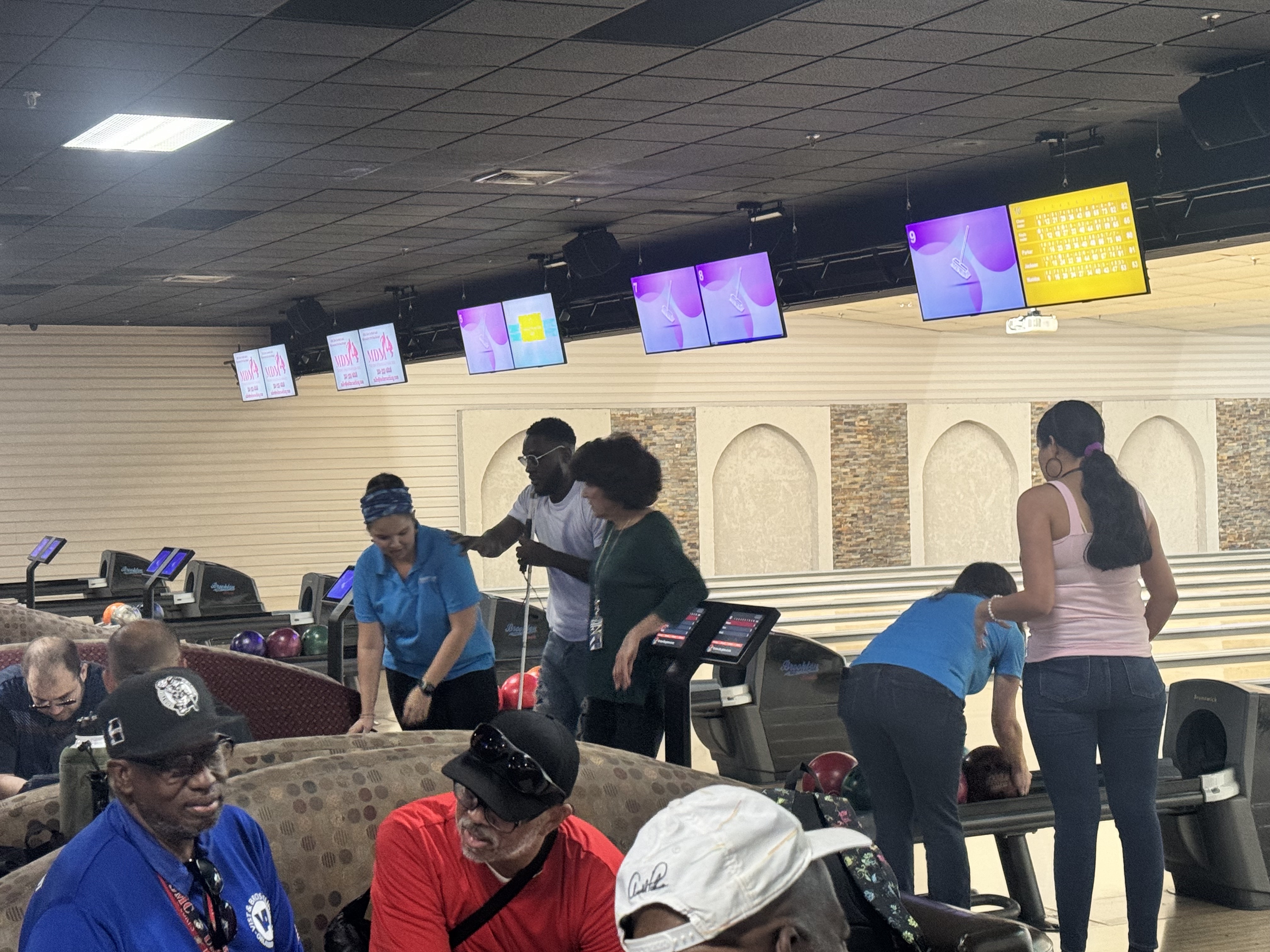 a group of people in a bowling alley