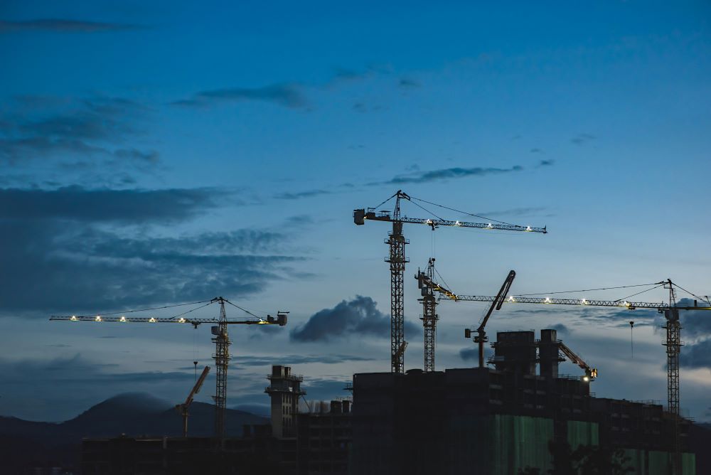 cranes at night with blue sky