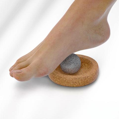 a foot stepping on a rock