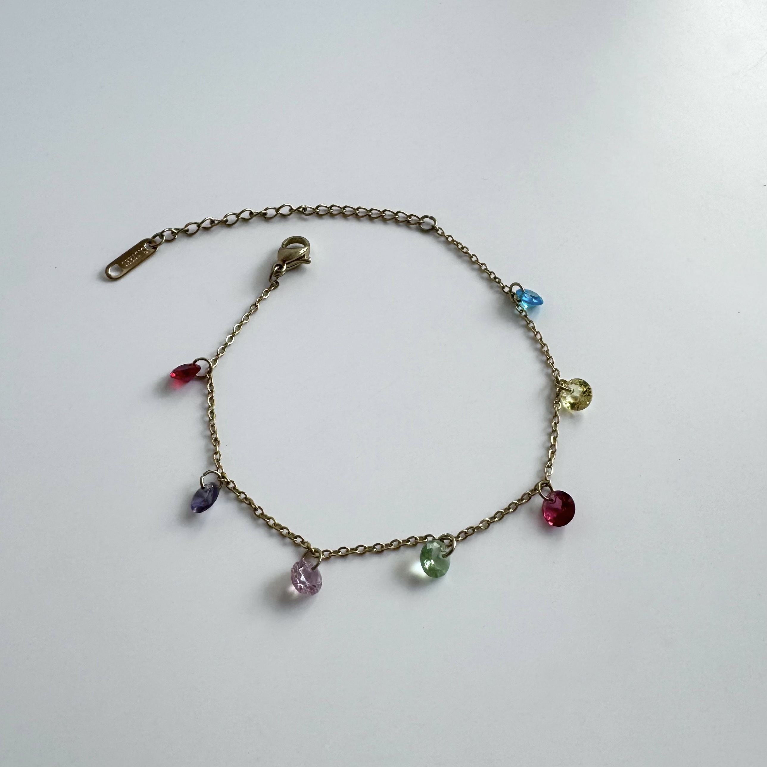 a necklace with colorful stones