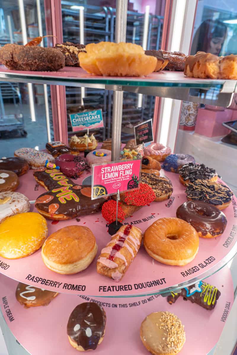 a display of donuts on a shelf