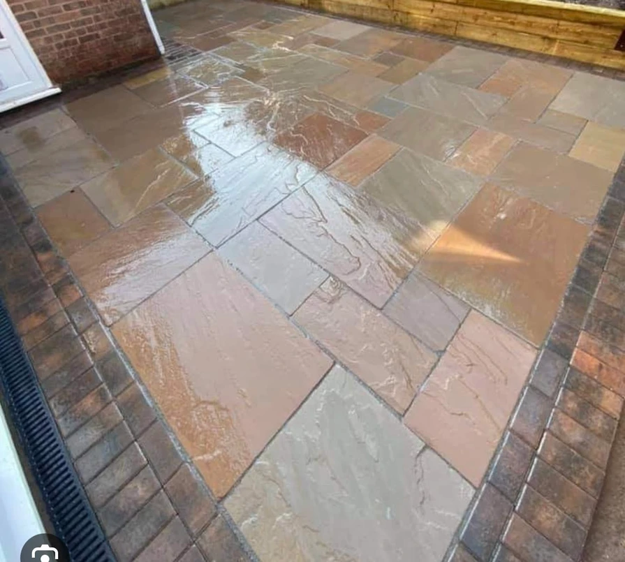 a wet patio with brick floor