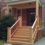 a wooden stairs leading to a house