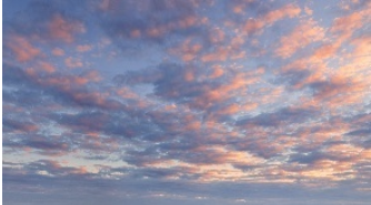 a cloudy sky with pink and blue colors