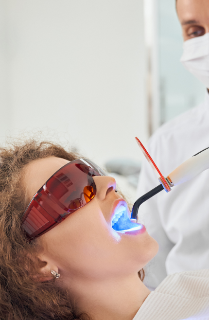 a woman getting her teeth lit