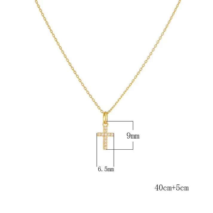 a gold necklace with a cross pendant