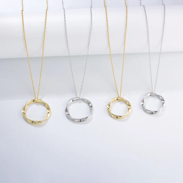 a group of necklaces on a white surface
