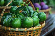 a basket of limes with water droplets on it