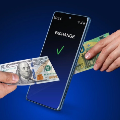 a hand holding money and a smartphone