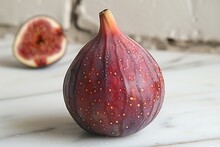 a fig on a marble surface