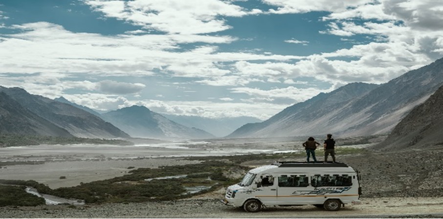 a van with people standing on top of it