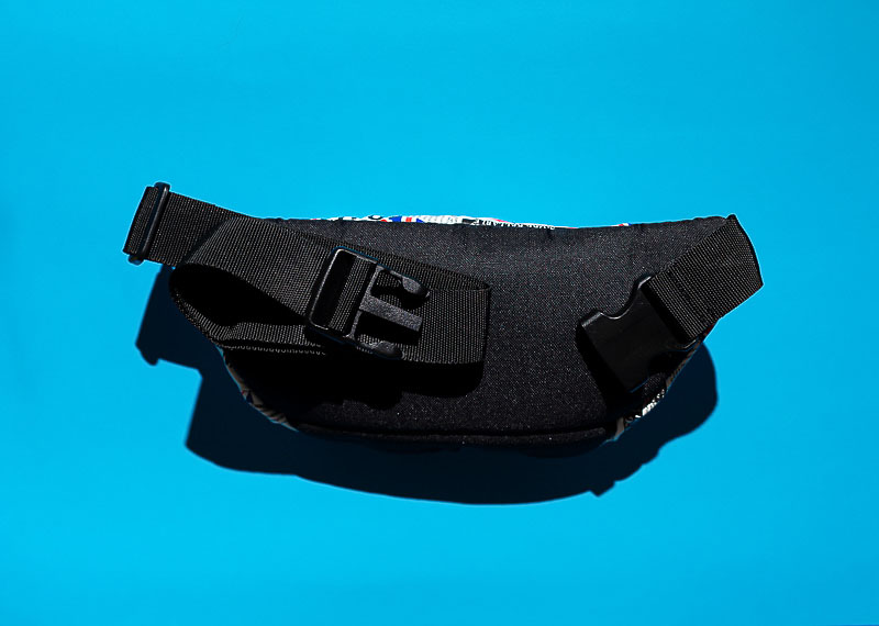 a black waist bag with straps