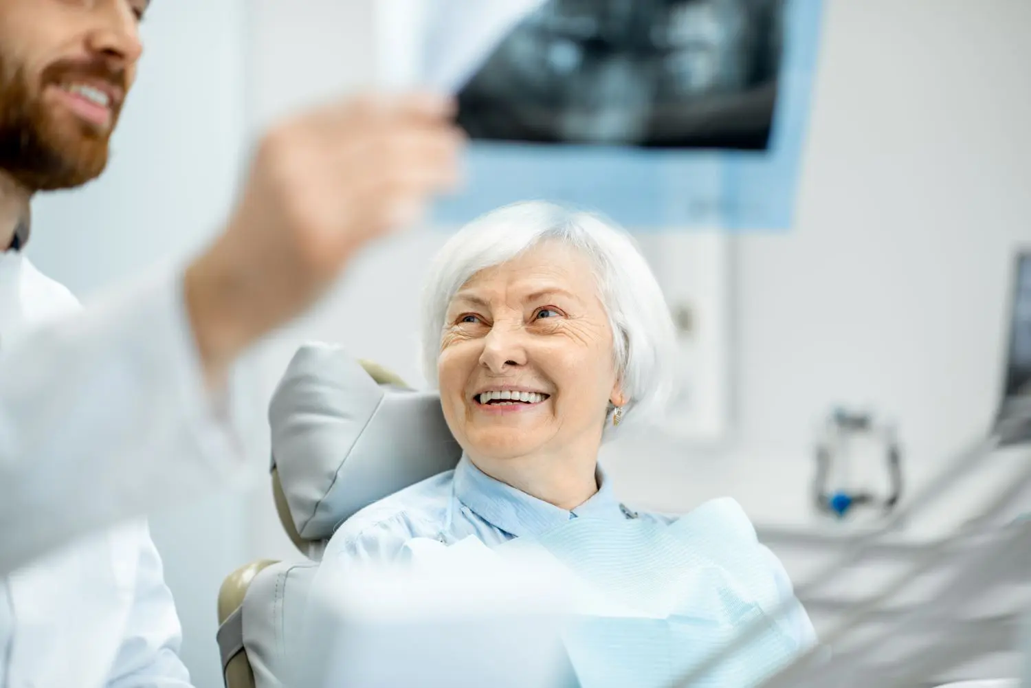 a woman smiling at a dentist