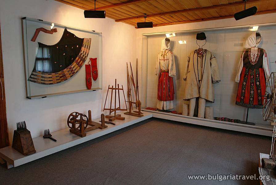 a display of clothes and objects in a room