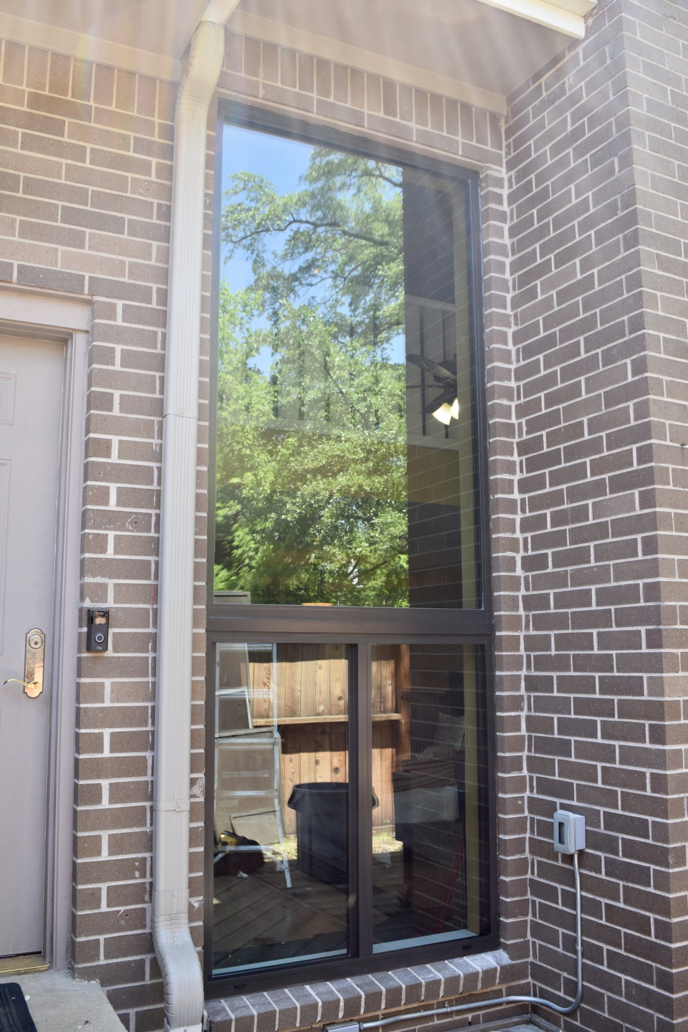 a brick building with a glass door