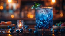 a blue drink with blue berries in a glass