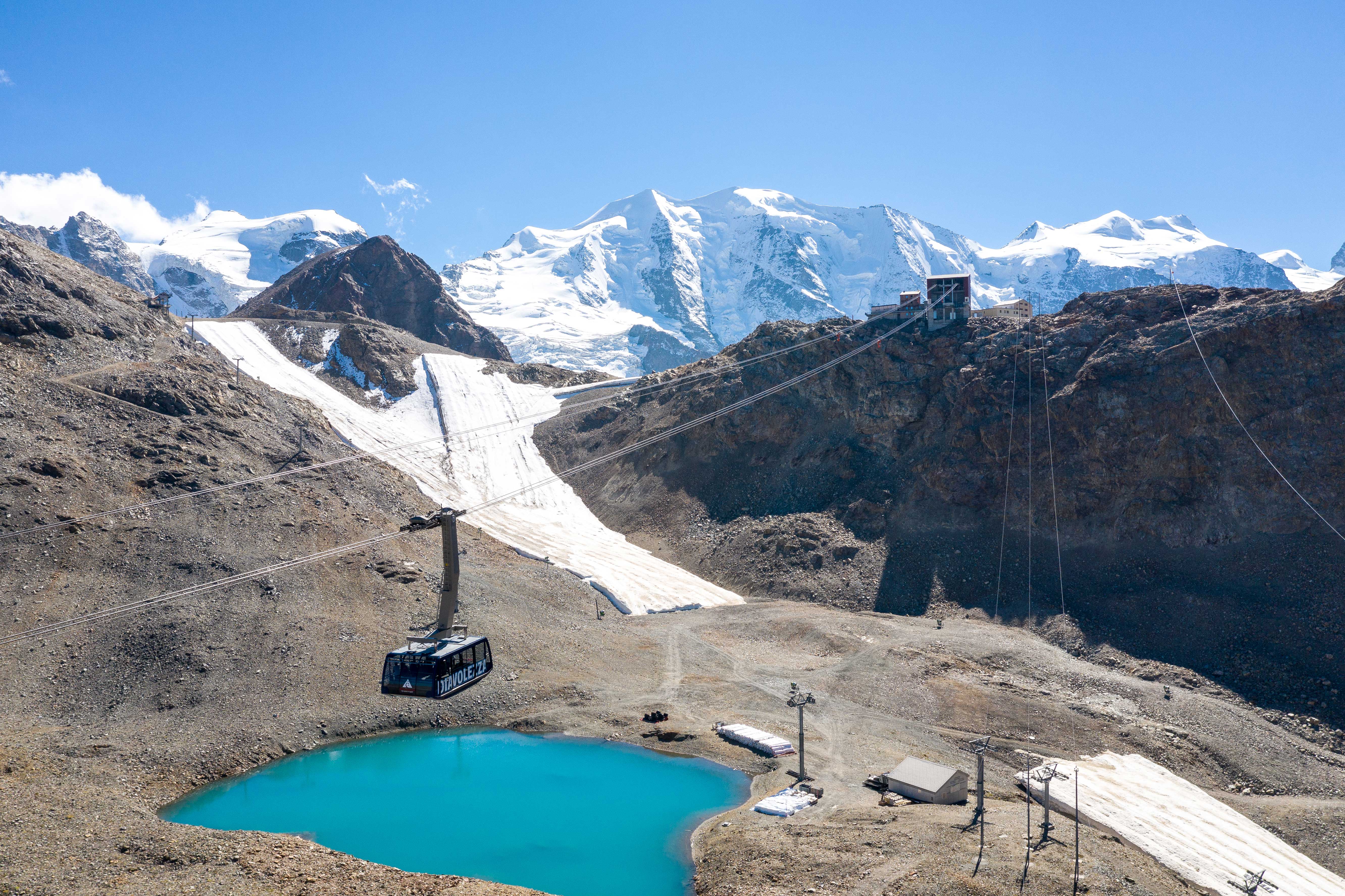 a ski lift above a lake