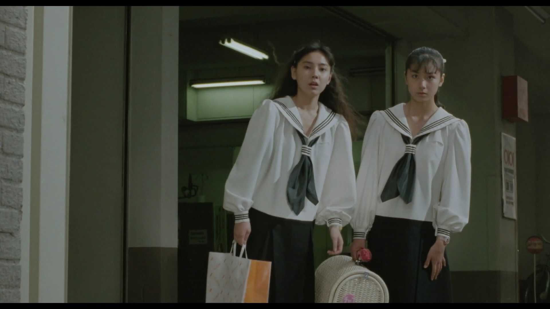 a couple of girls in white and black uniforms