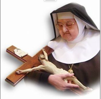 a nun holding a crucifix